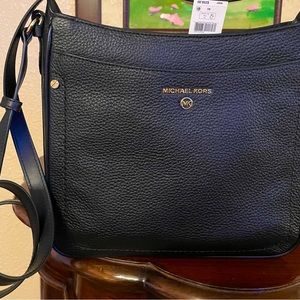 New black Crossbody leather purse .